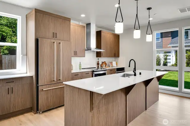 The oversized island is a showstopper — offering extra seating and a natural gathering place for guests.