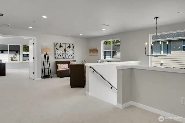 Large landing at the top of the stairs has many options for additional living space.