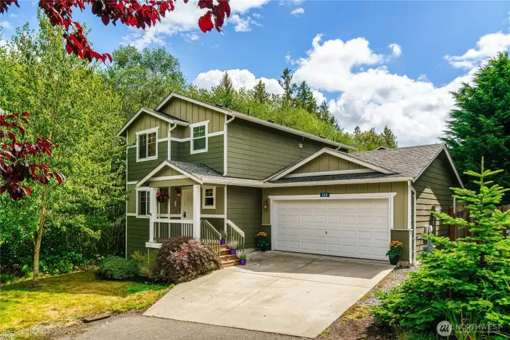 Beautiful two-story home that sides to the greenbelt for extra privacy.