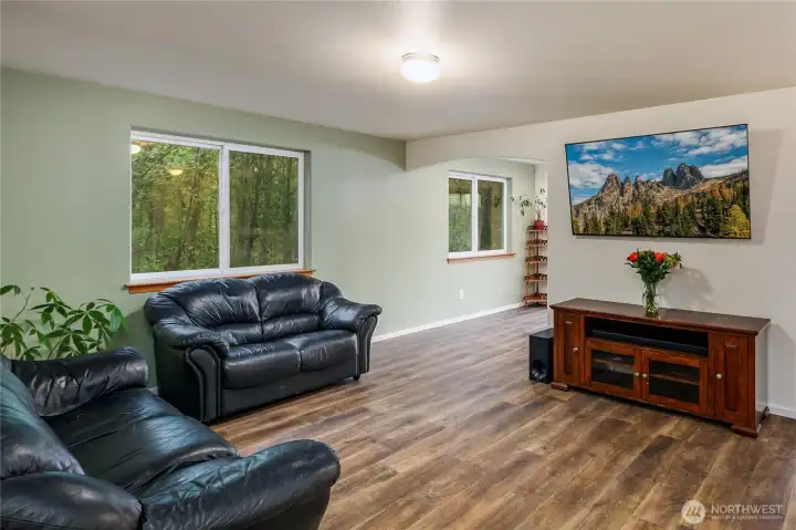 Light & bright living area that sides to the greenbelt.