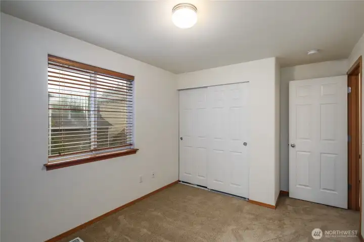 Good sized second bedroom with views of the greenbelt.