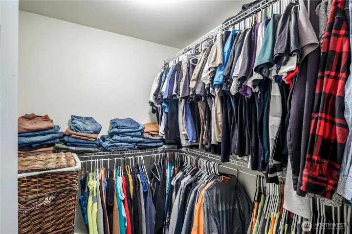 Walk in closet in primary bedroom.