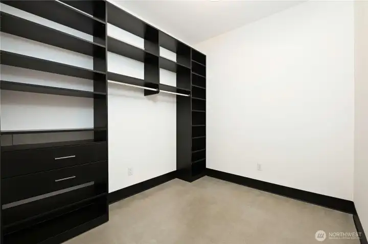 Primary bedroom walk-in closet