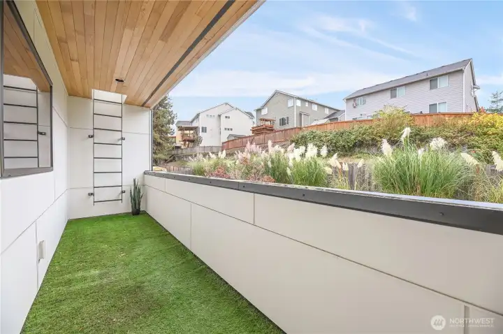 Covered balcony and roof access for rooftop deck