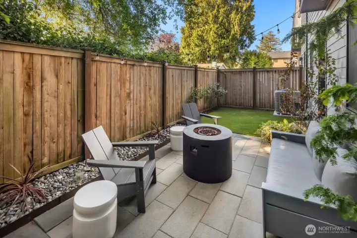 Fully fenced backyard with patio.