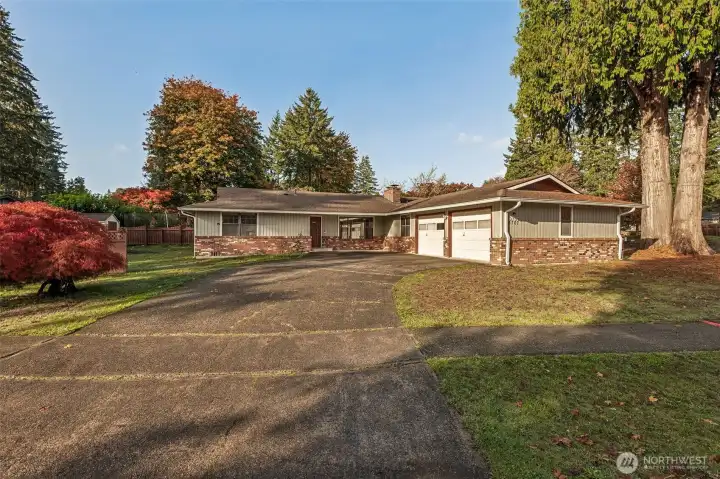 Front view of home, I LOVE the huge driveway for all of your and your guests! Larger corner lot with mature trees.