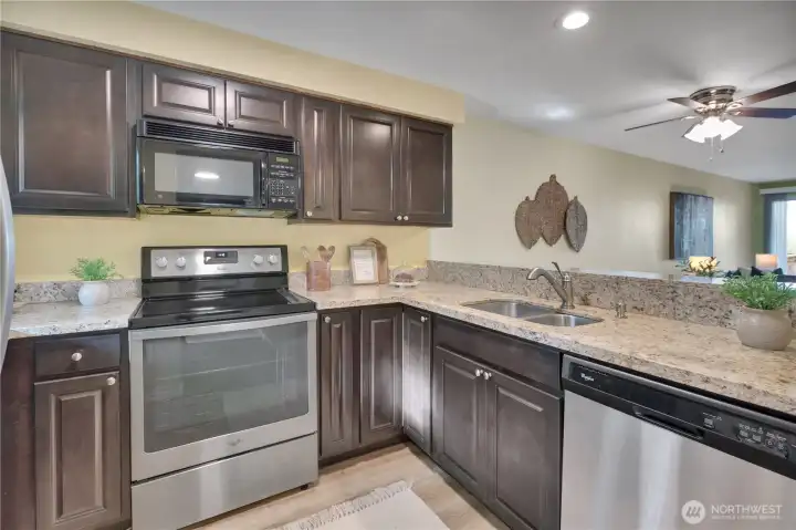 Bright kitchen and Grant counter tops all stainless steel appliances stay