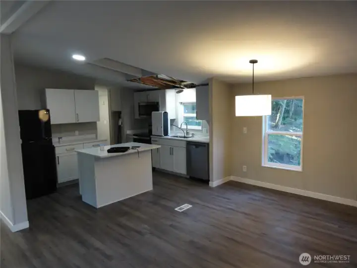 Open concept for living room, dining area and kitchen.