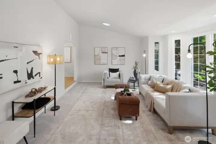 Expansive formal livingroom featuring cathedral ceiling and a stunning bay window
