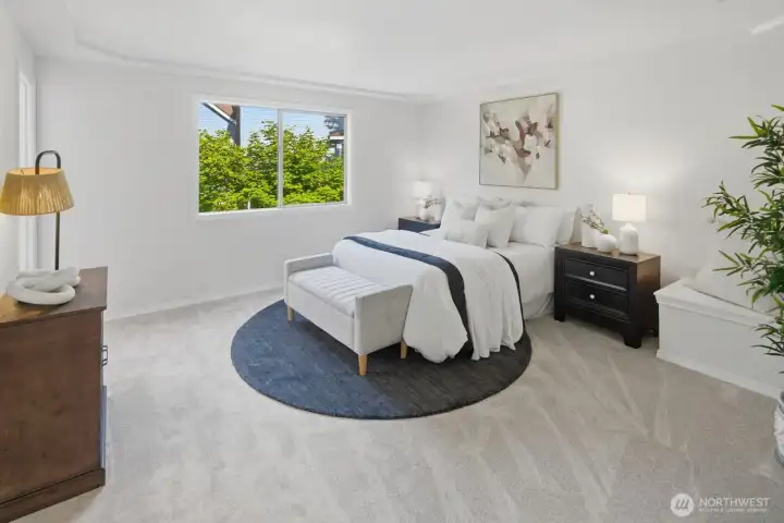 Luxurious primary suite offering a private retreat with a walk-in closet and a stunningly updated ensuite bathroom