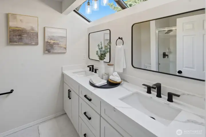Beautifully updated spa-like ensuite bathroom with double-sink vanity and walk-in shower
