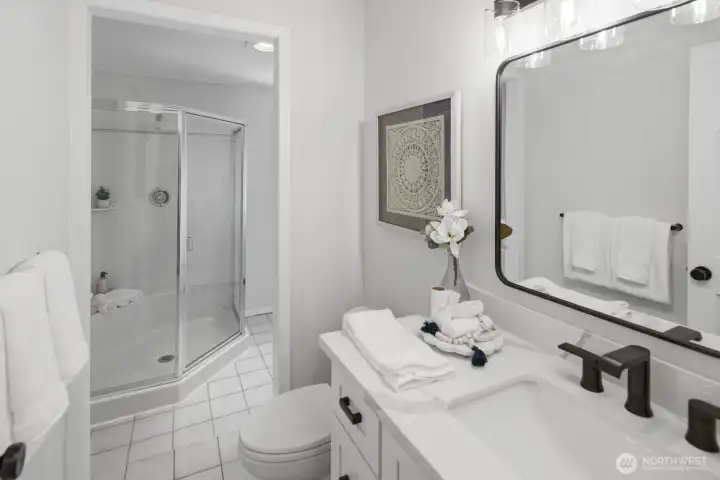 Beautifully updated lower level bathroom, complete with walk-in shower