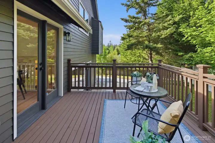 Inviting and updated, main level deck is ideal for private BBQs, a morning coffee, or for relaxing evenings surrounded by nature