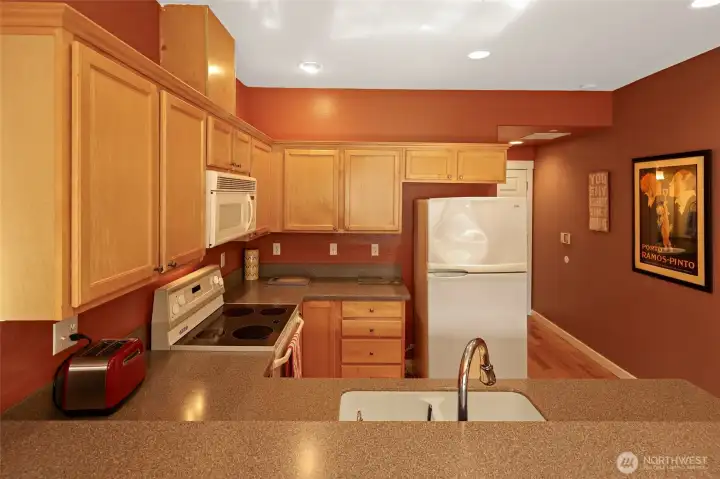 More decorative space above cabinets! Also, powder bath off hallway to garage!