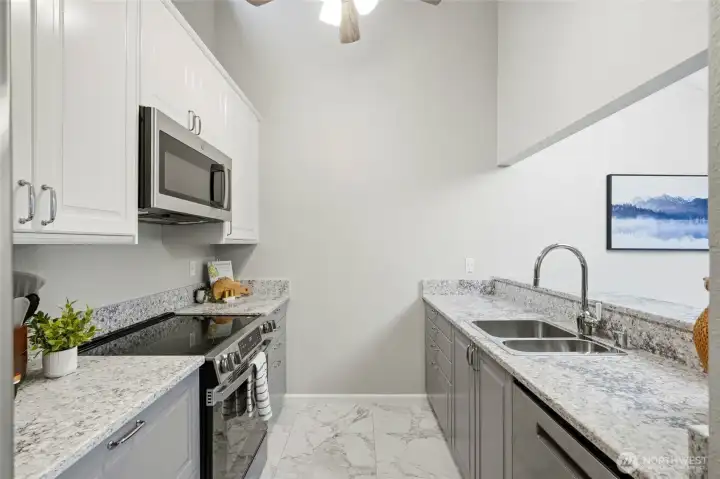 Gorgeous remodeled kitchen, so light and bright with the upper wall window