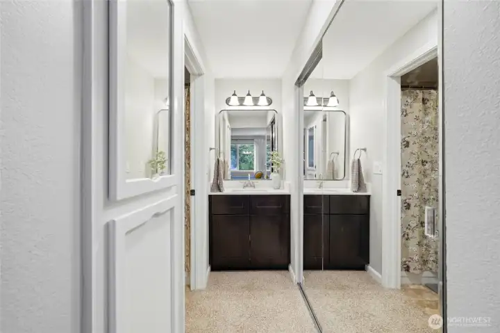 updated primary bathroom with storage and large closet