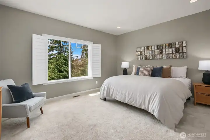 Spacious main-floor primary bedroom.
