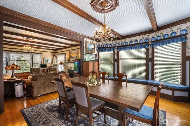 Formal dining room with built-ins under the bay windows...