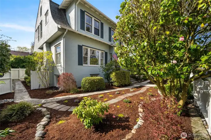 This path through the front garden leads to back yard and lower level entrance...