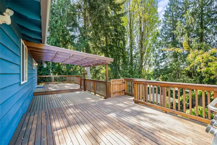 The large deck is partially covered for year around enjoyment.