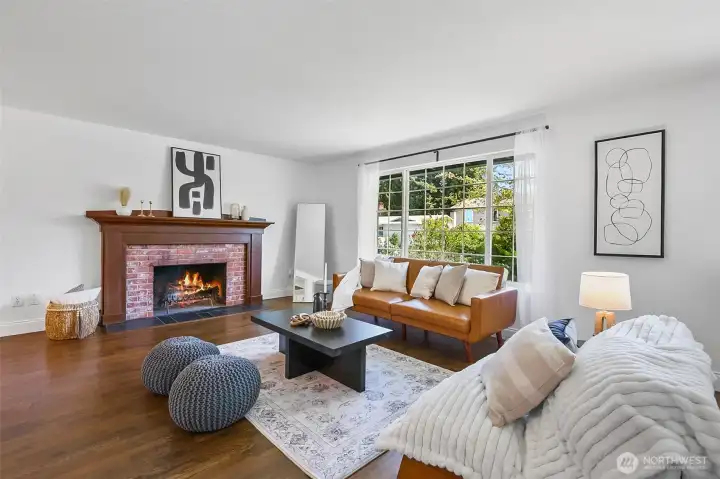 Living room with wood burning fireplace.