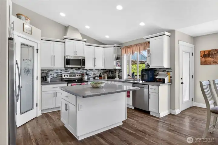 Quartz countertops, soft close cabinets, tile backsplash