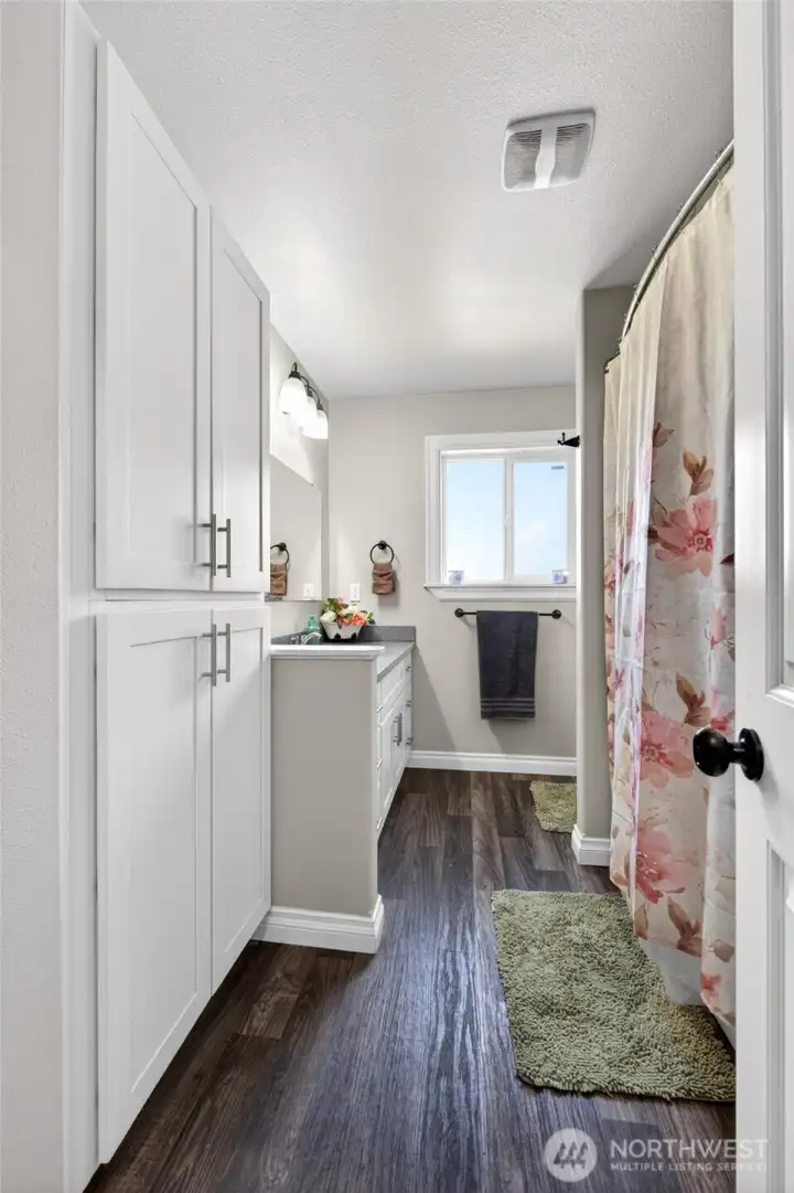 Full Guest Bathroom between the two Guest Bedrooms. Loads of cabinet space!