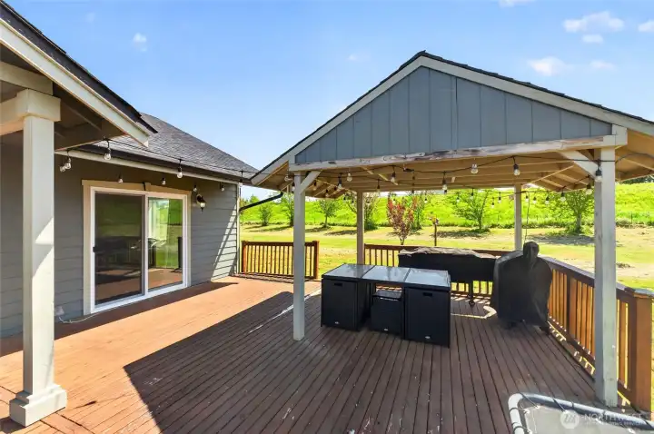 Back deck with access to the primary and the kitchen