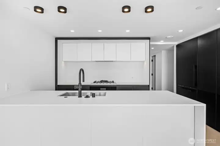 Stunning chef's kitchen with B&B Italia cabinetry, Miele appliances, and Kohler fixtures