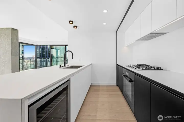 Stunning chef's kitchen with B&B Italia cabinetry, Miele appliances, and Kohler fixtures