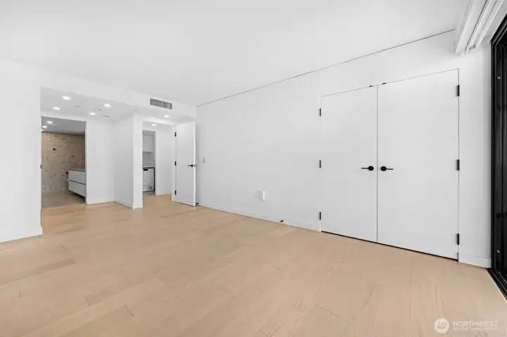 Primary bedroom with walk-in closet and access to wrap around deck and the views!