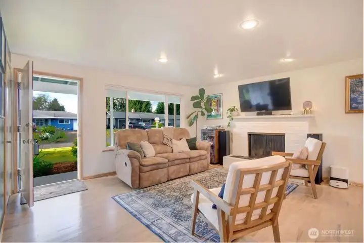 A welcoming entry leads to the fully finished on site oak hardwood floors