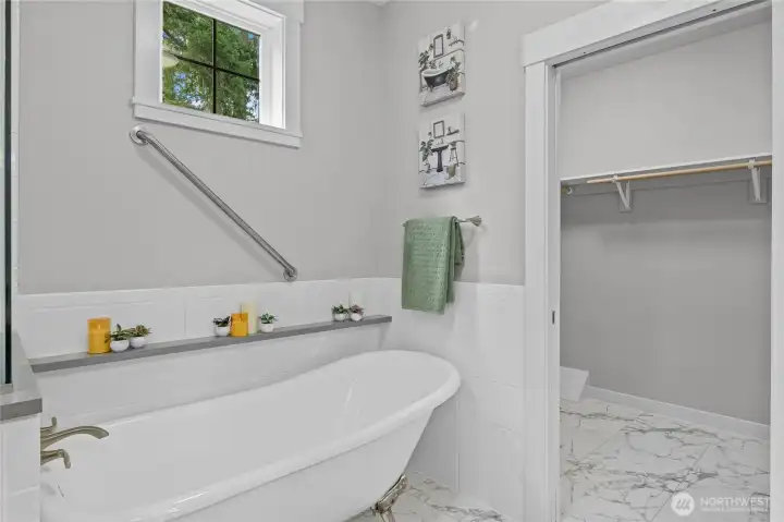 Relaxing claw foot bath tub in your primary suite