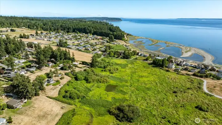 This acreage is the second to the left, you can see the blue house and outbuildings in the upper section. This property is much longer than the mowed upper field areas. This photo also shows the tidelands patterns at a lower tide in Useless Bay along Sunlight Beach. This acreage is the second to the left, you can see the blue house and outbuildings in the upper section. This property is much longer than the mowed upper field areas. This photo also shows the tidelands patterns at a lower tide in Useless Bay along Sunlight Beach.