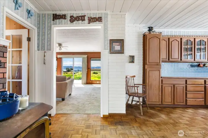 Step from the kitchen into the large living room, facing the wonderful views. Step from the kitchen into the large living room, facing the wonderful views.