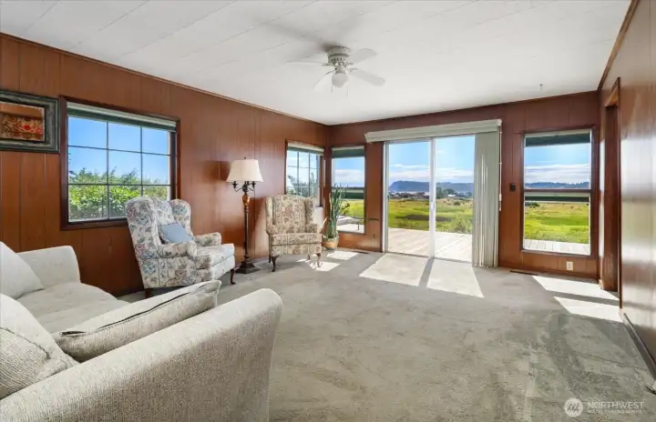 This living room overlooks so much! Come take a look, and imagine the lifestyle this acreage can bring to you. This living room overlooks so much! Come take a look, and imagine the lifestyle this acreage can bring to you.