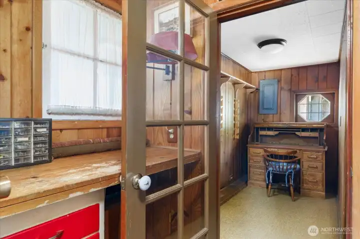 This combination work/storage area and den/office are inside the house. There is another workshop in the side yard pasture which has more space. This combination work/storage area and den/office are inside the house. There is another workshop in the side yard pasture which has more space.