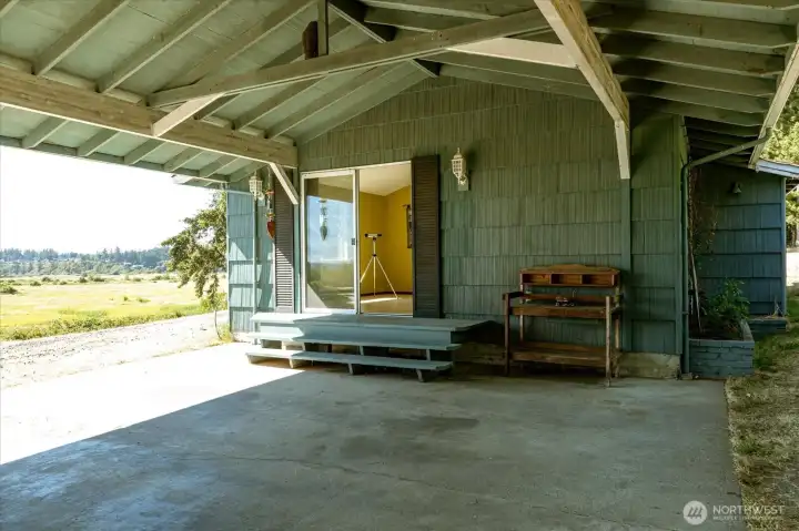 Looking towards the studio door, thru the carport. Looking towards the studio door, thru the carport.