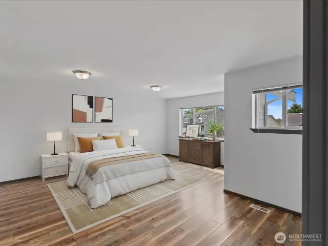 1 of 4 bedrooms on second level - all with walk-in closets! Updated laminate flooring.