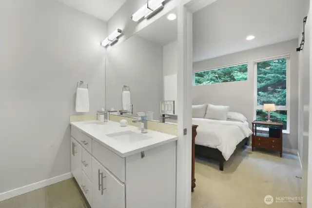 Primary Bathroom has Double Sinks, Shower and Tub
