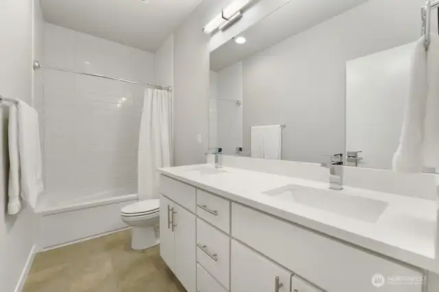 Top-floor  Bathroom with Double Sinks and Tub