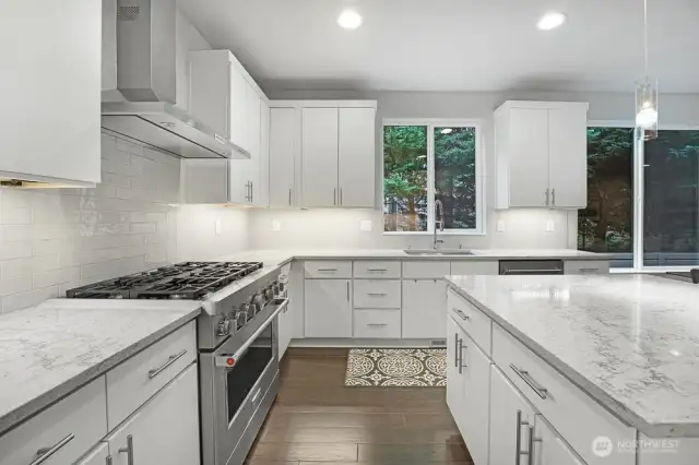 Kitchen with Large Island and KitchenAid Red Medallion Series Appliances