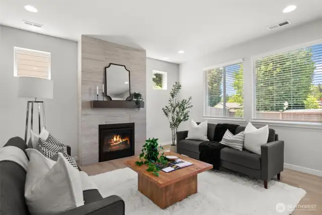 Well placed windows, including transom windows maximize natural light for a bright and cheerful living space.
