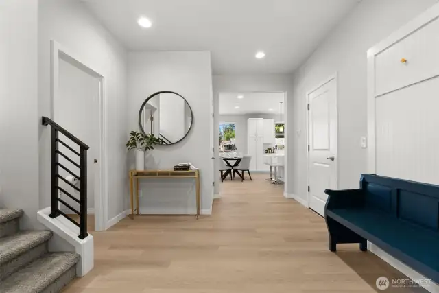 Beautifully engineered hardwood flooring has just been installed! Its soft brown tone pairs perfectly with the bright interior paint and crisp white millwork, creating a stunning first impression as you enter the home.