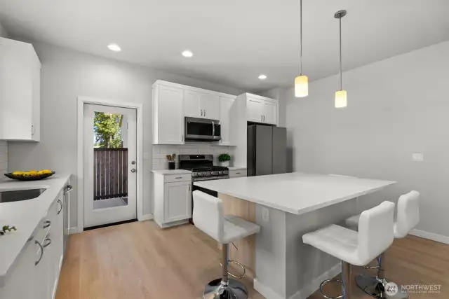 Sleek quartz countertops deliver a polished, contemporary feel with plenty of room for all your holiday cooking and entertaining needs.