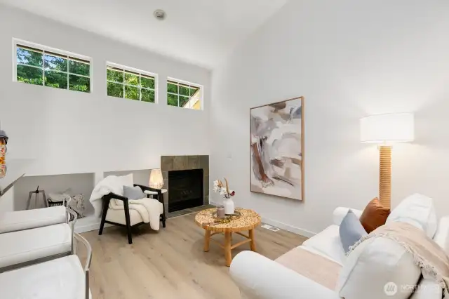 Family room off the kitchen offers a gas fireplace
