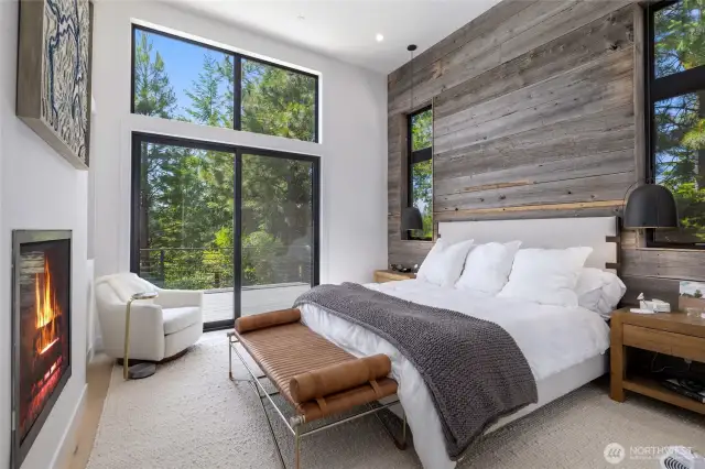 Primary on main floor w/old barnwood accent wall.