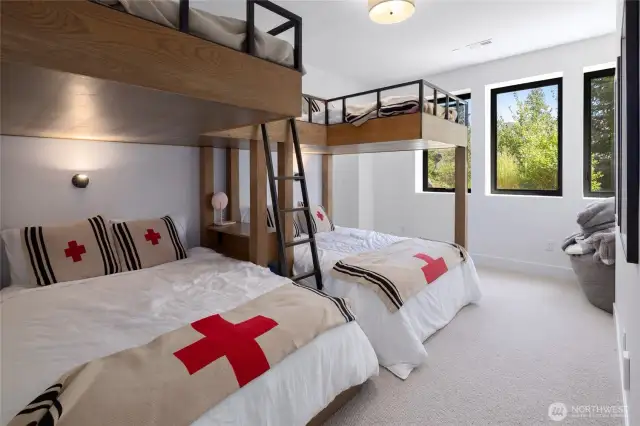 (6) twin beds over (2) queen beds in bunkroom.