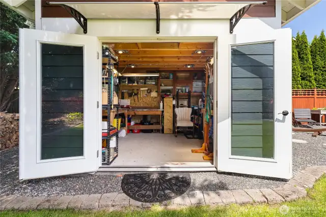 Shop includes attic storage, can lights and heat.
