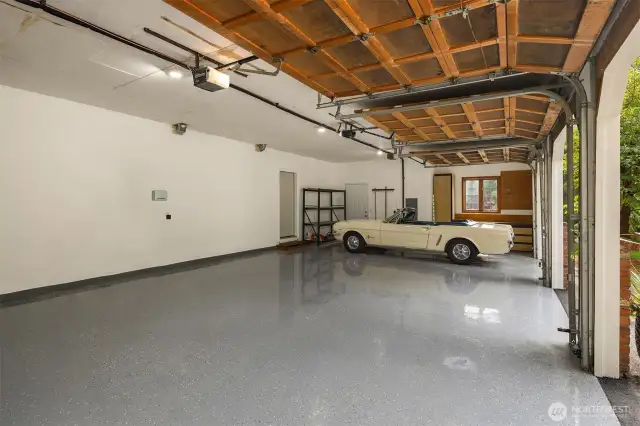 New epoxy floors in spacious 3 car garage with extra storage!